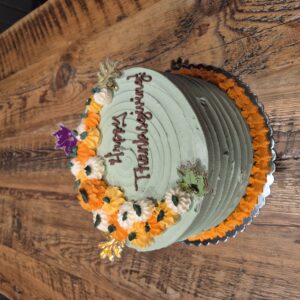 Pumpkin Patch Cake 9" serves 6-8 (Vanilla cake, cinnamon cream filling, vanilla buttercream icing)