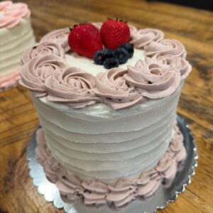 Strawberry Blueberry Bliss Cake (vanilla cake layered with fresh strawberries and juicy blueberries, finished with creamy vanilla buttercream)