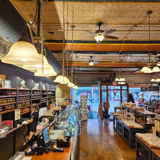 Inside the Mariposa Market: the main floor counter and tin ceiling